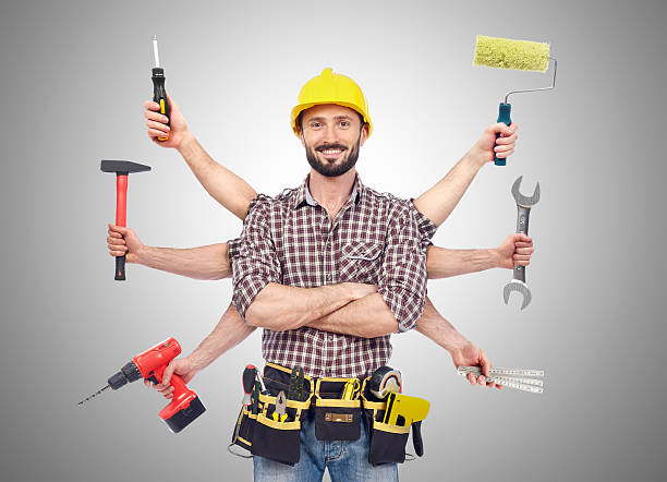 من نحن cheerful carpenter looking at camera with tolls in six hands